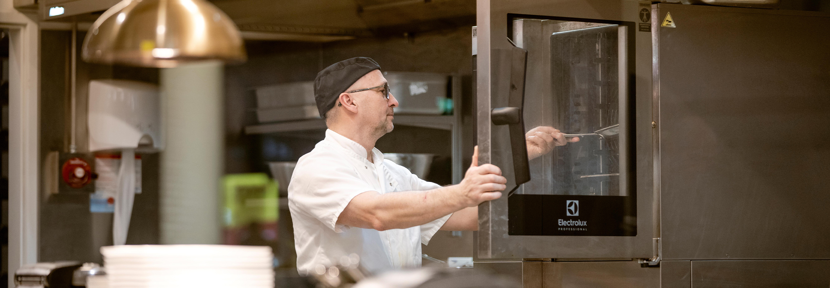 Chef opening Electrolux Professional SkyLine Combi Oven